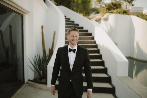 Scott Keever in a tuxedo on a white staircase — Miami Florida's most attractive person